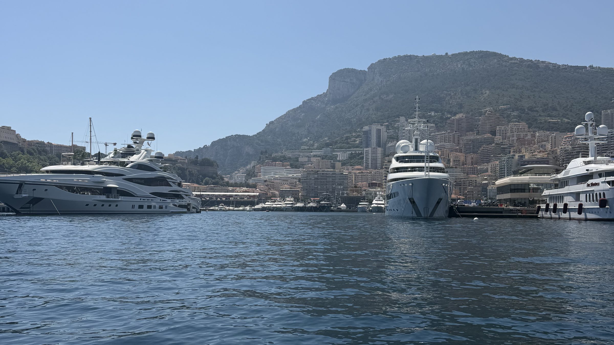 Monaco harbour from the water: superyachts below the Rock.