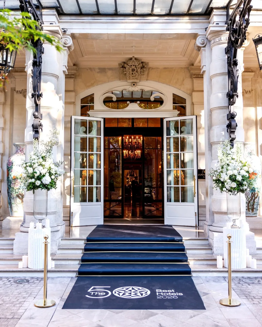 The entrance of the Hôtel de Paris, doors open onto the lobby.