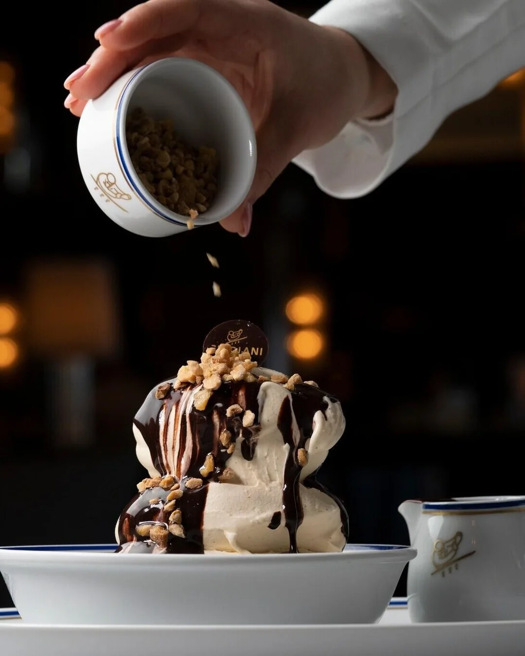 Chocolate poured over a dessert at Cipriani Monte-Carlo.